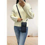 Vue 1 du Pochette téléphone bandoulière femme bleu marine en cuir synthétique par Flora & co.