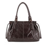 Vue principale du Sac cabas bowling lacet similicuir lisse Chocolat en Synthetique couleur CHOCOLAT.